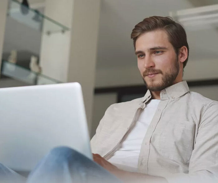 Tradie Using Computer to Monitor Leads